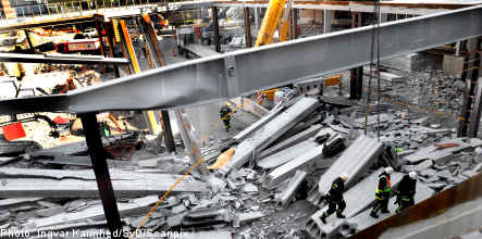 Police investigate building site collapse
