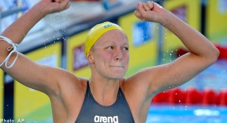 Sjöström swims to title in world record time