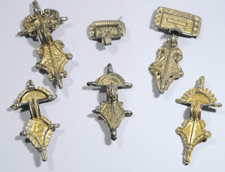 Valuable brooches found in the houses at Sandby fort, but left untouched by attackers.Photo: Max Jahrehorn, Oxider AB
