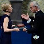Jenny Munro, daughter of the 2013 Nobel Prize Laureate in Literature Alice Munroe of Canada, receives the Nobel Prize in her place from Sweden's King Carl XVI Gustaf.Photo: TT