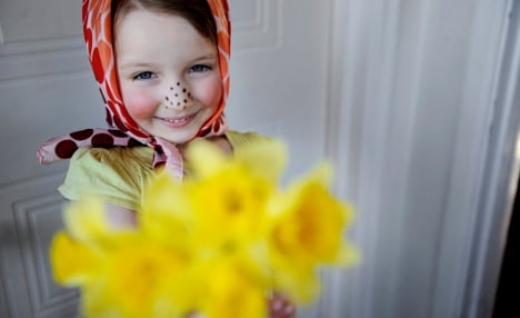 Kids in Victorian garb mark Swedish Easter