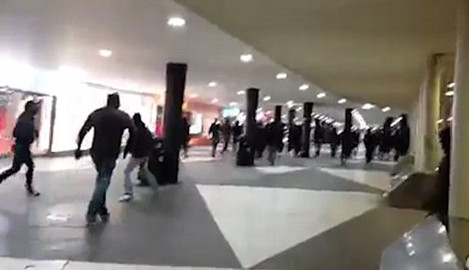 Masked marchers beat immigrants in Stockholm