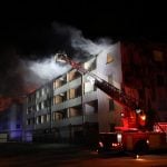 100 apartments evacuated after fire in western Sweden