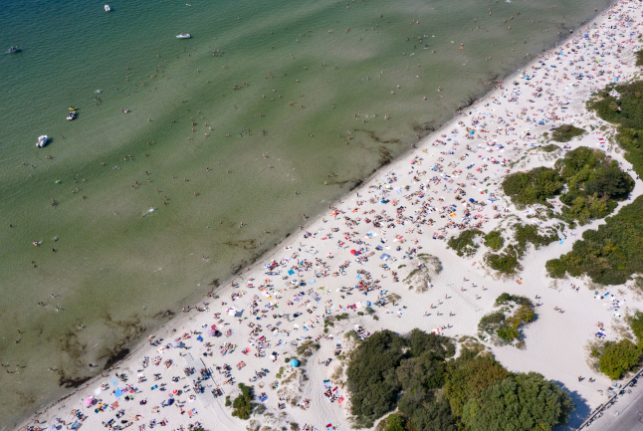 In Pictures: Crowds flock to Swedish beaches as summer heatwave hits